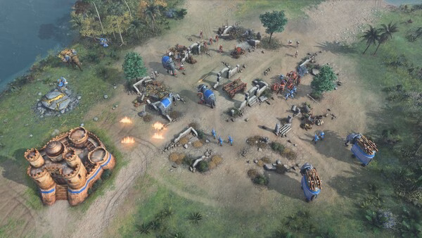A screenshot from Age of Empires IV: Dynasties of the East showing a bustling military camp with soldiers, siege weapons, and fortifications.