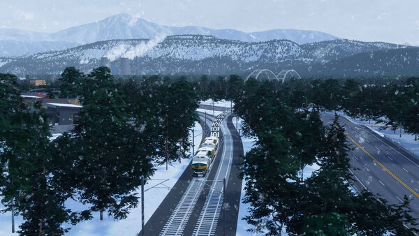 A Cities: Skylines II screenshot showing a snowy landscape with a train on tracks, a highway, and mountains in the background.