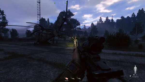 Screenshot from the game Active Matter showing a player aiming at a glowing figure near a crashed helicopter in a forest.