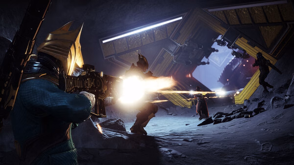 A Destiny 2 screenshot showing a Guardian in golden armor firing a rifle at enemies in a sci-fi cave with glowing structures.