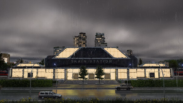 A Transport Fever 3 screenshot showing a brightly lit train station at night with cars passing in the foreground.