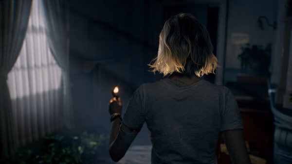 A screenshot from Resident Evil Requiem shows a character holding a lit candle, exploring a dimly lit, eerie room.